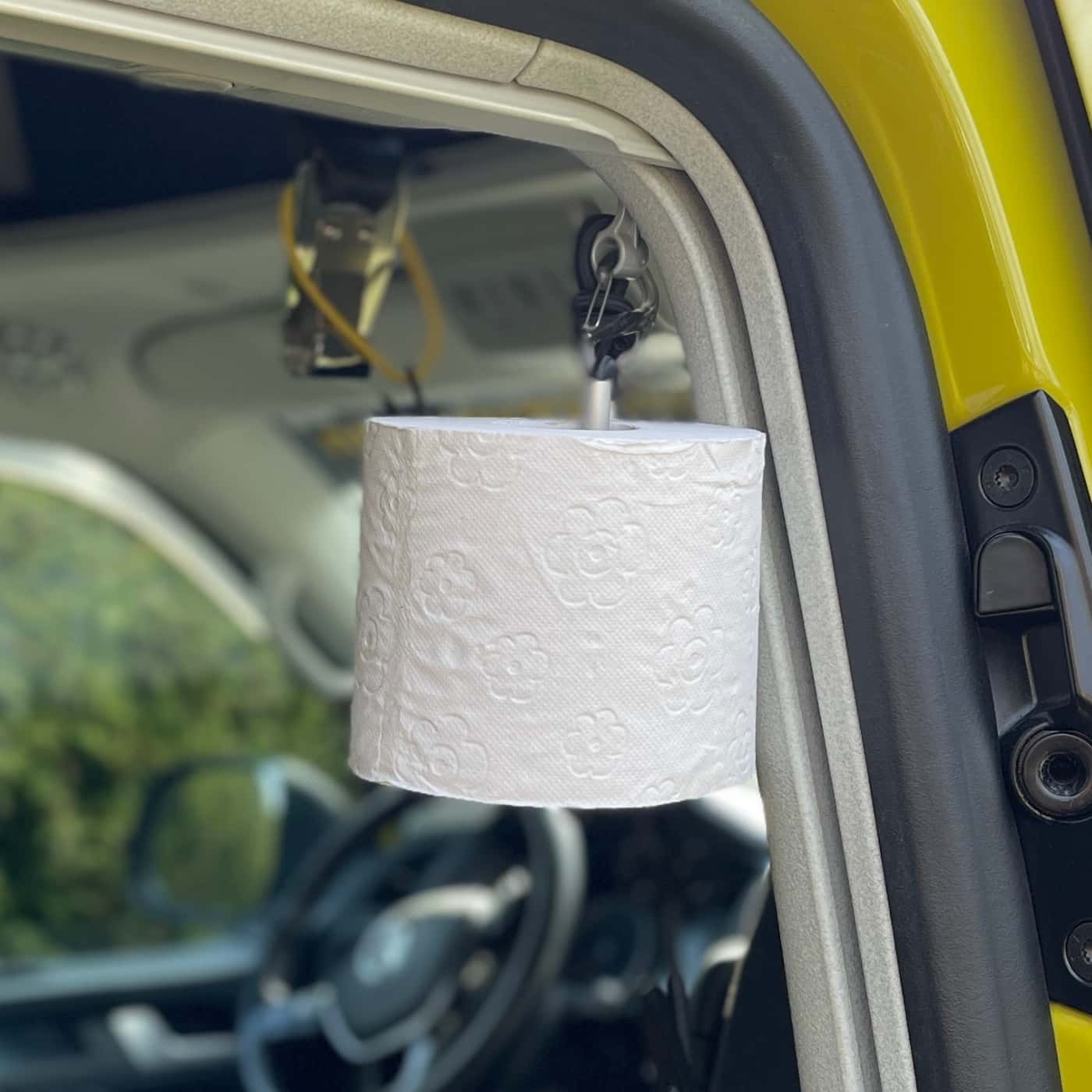 Toilet paper roll on the hook CLAMPS in the sliding door of the VW bus